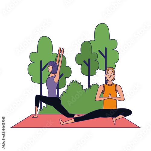 young couple practicing yoga poses at outdoors