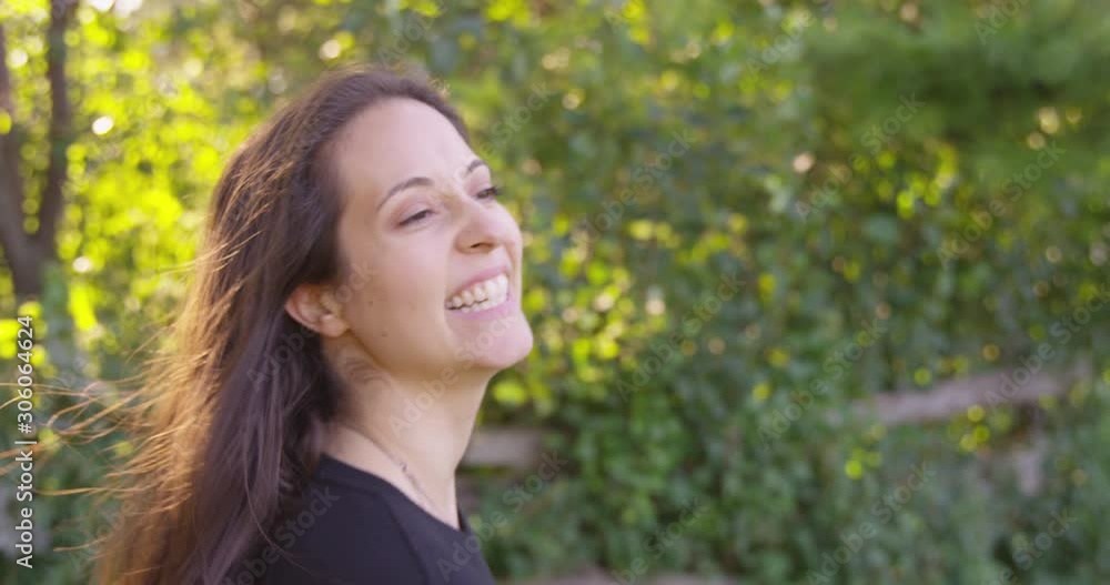 Happy woman spins and dances while smiling. - Slow Motion - shot on RED Happy woman spins and dances while smiling. - Slow Motion - shot on RED