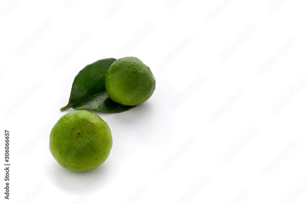 Fresh green lime with leaf isolated on white background - image Fresh green lime with leaf isolated on white background - image