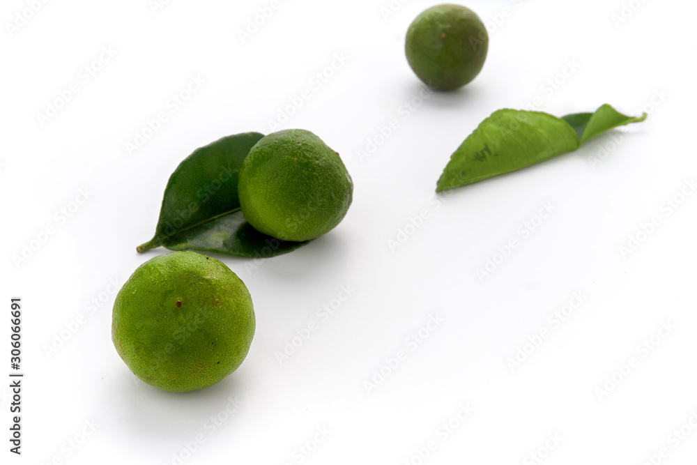 Fresh green lime with leaf isolated on white background - image Fresh green lime with leaf isolated on white background - image