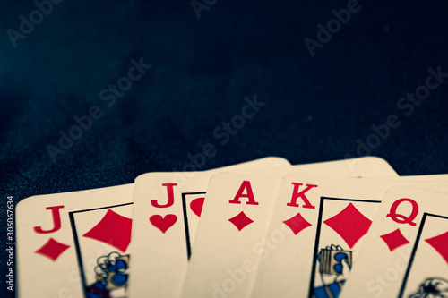 euchre diamond hand on black background photo