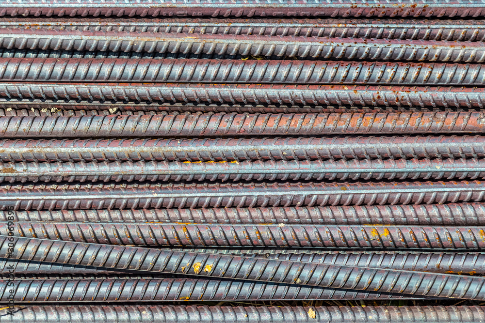 Pile of construction metal reinforcement at a construction site close-up. Pile of construction metal reinforcement at a construction site close-up.