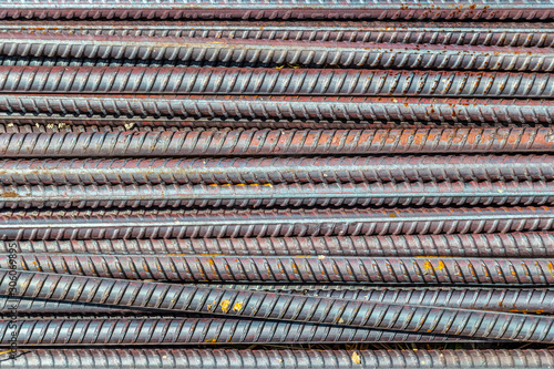 Pile of construction metal reinforcement at a construction site close-up.