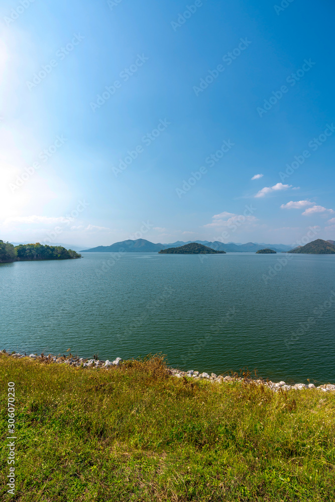beautiful blue sky green forest mountains lake view at Kaeng Krachan National Park, Thailand.  an idea for backpacker camping relaxing hiking on long holiday weekend a couple,  family activity campfir