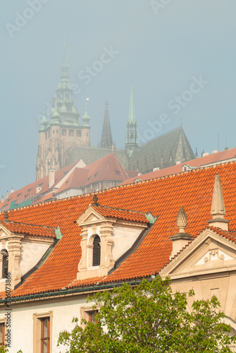 Misty morning view to Prague city  Saint Vitus cathedral and Vltava river  fog. Czech Republic