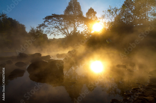 Sunrise and sunlight with fog in mineral water morning at Chae Son National Park Mueang Pan district, Lampang province Thailand
