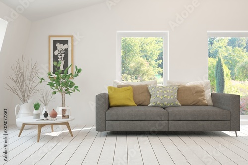 Stylish room in white color with sofa and summer landscape in window. Scandinavian interior design. 3D illustration