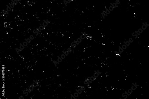 WHITE BOKEH ON A BLACK BACKGROUND. LIGHT SPOTS TEXTURE. FALLING SNOW. STAR SKY.