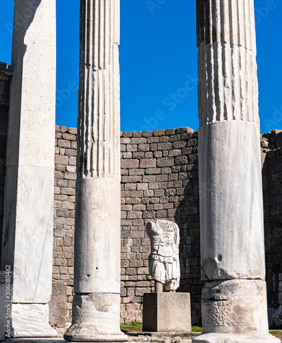 Headless statue and white columns, The Temple of Trajan in Pergamon, Bergama,...