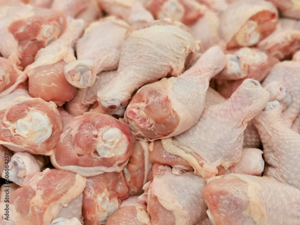 A pile of raw chicken legs A pile of raw chicken legs