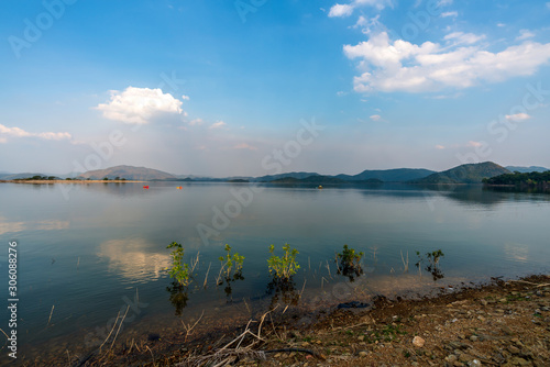 Fototapeta Naklejka Na Ścianę i Meble -  beautiful blue sky green forest mountains lake view at Kaeng Krachan National Park, Thailand.  an idea for backpacker hiking on long weekend or a couple, family holiday activity camping relaxing