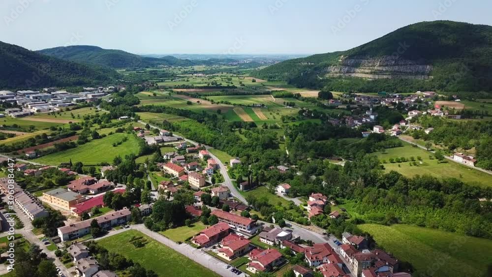 Forward drone shot above Ponte San Quirino, Italy, surrounded by mountains Forward drone shot above Ponte San Quirino, Italy, surrounded by mountains