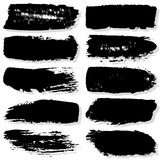 Strokes with a dry brush. Vector texture of paint spots. Set of grunge blots. The template for the background. Black ink isolated on white