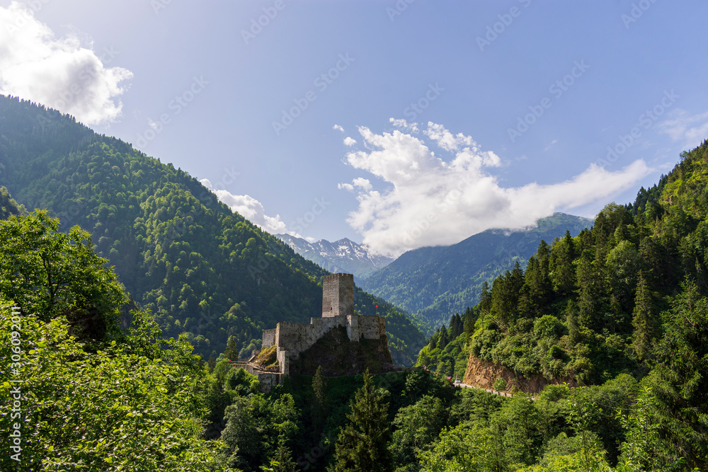 Landscape of Zilkale castle, forest, and cloudy mountains. Castle located in Camlihemsin, Rize, Black Sea region of Turkey