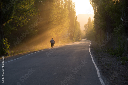 The road in the fog. Sunset. The sun.