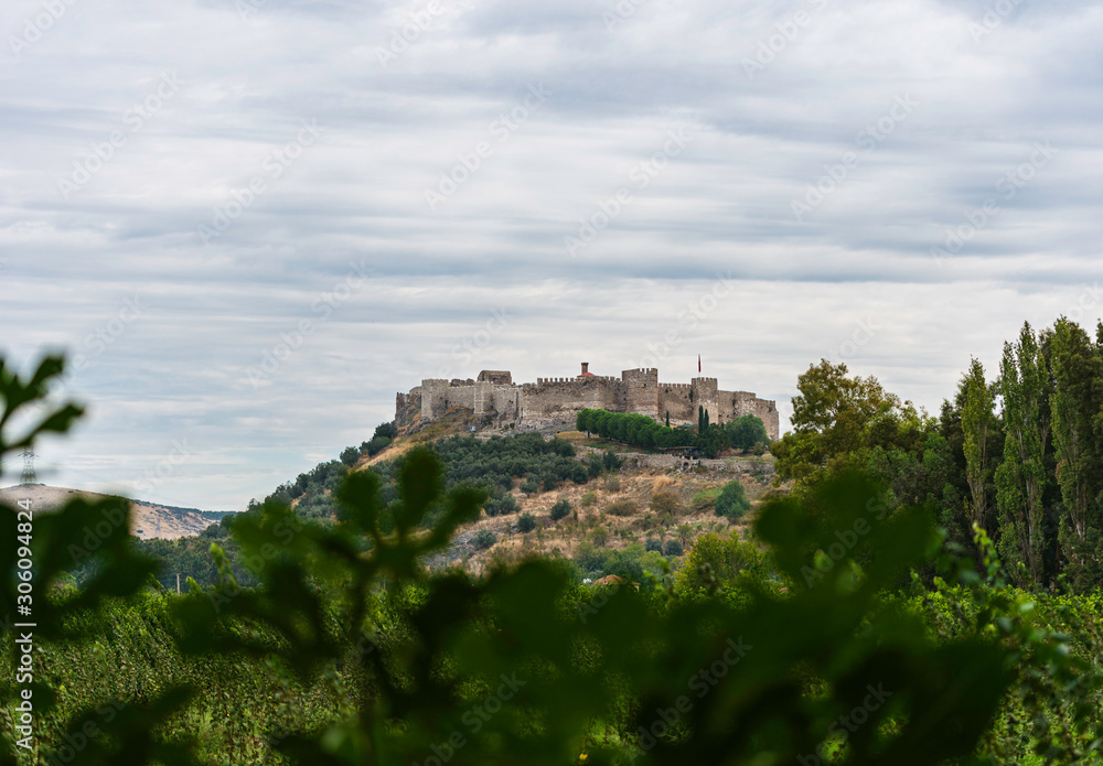 Castle on the hill. Remote view of Ayasuluk Castle (Selcuk Kalesi) and St. John's Church. 