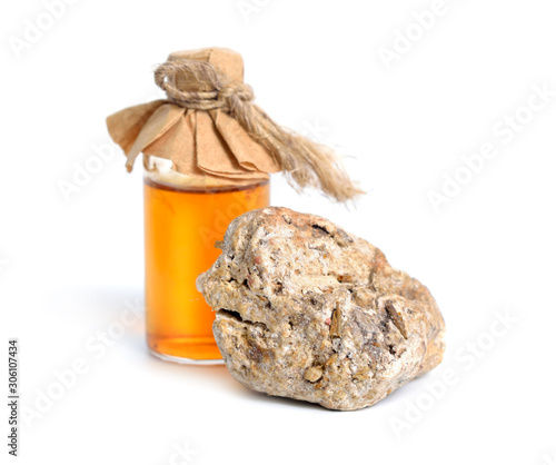 Ambergris, ambre gris, ambergrease or grey amber. Isolated on white background photo