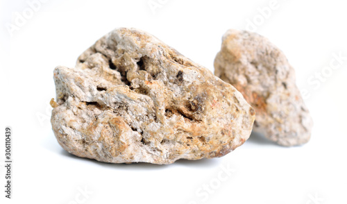 Ambergris, ambre gris, ambergrease or grey amber. Isolated on white background photo