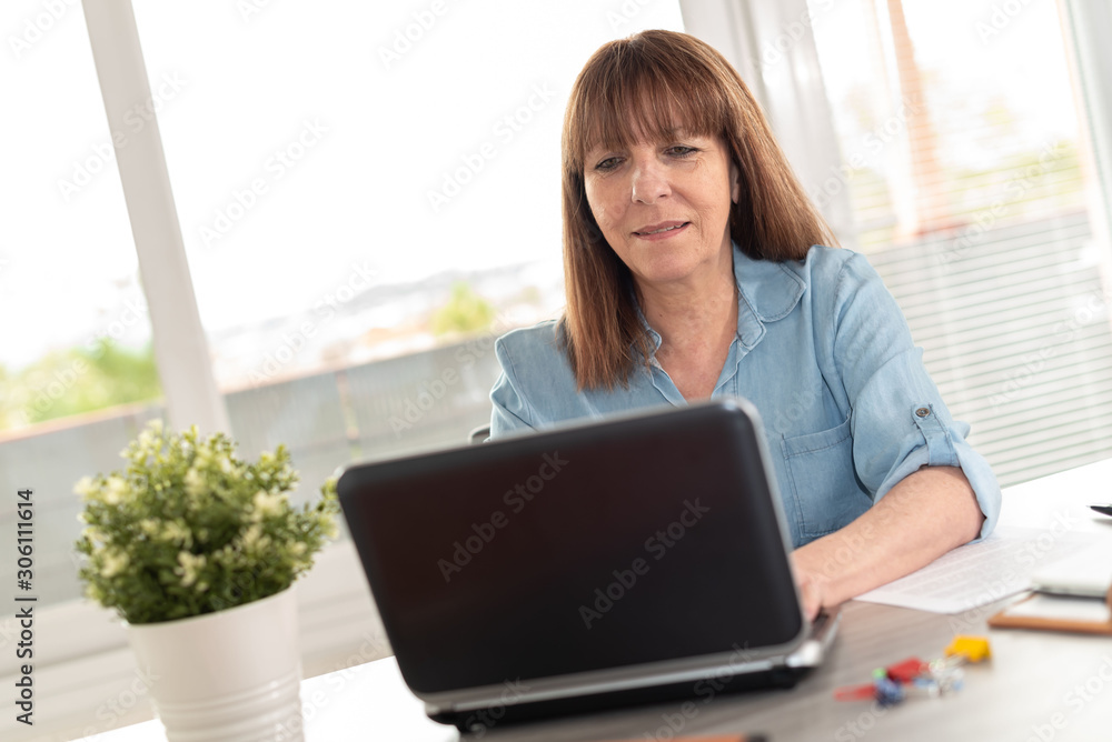 Businesswoman working on laptop Businesswoman working on laptop