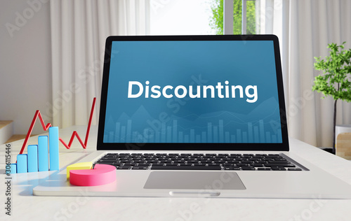 Discounting – Statistics/Business. Laptop in the office with term on the Screen. Finance/Economy.