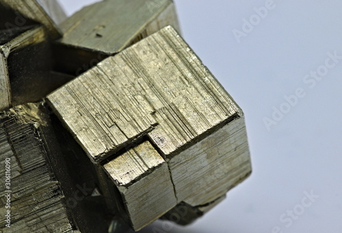 Photography Close up detail on a cube of pyrite isolated single shiny mineral stone, fool's