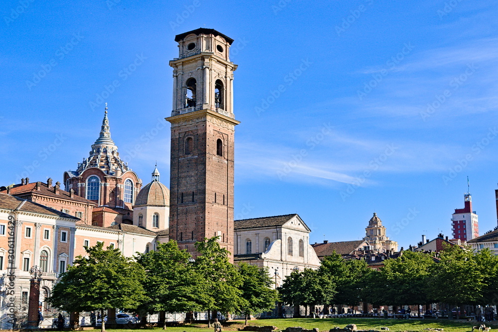 Turin Cathedral with Guarini Dome, bell tower and Roman walls remains seen at sunset from the Palatine Gate park