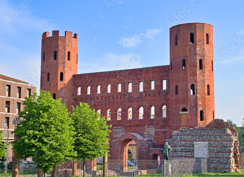 View on the Porte Palatine, ancient gateway to the Roman city of Augusta Taurinorum, in a bright spring morning, Turin, Piedmont, Italy photo