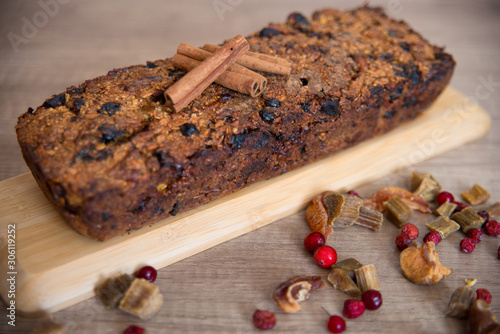 Homemade fruit bread with cosy winter decorations