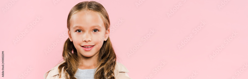 panoramic shot of smiling kid looking at camera isolated on pink panoramic shot of smiling kid looking at camera isolated on pink