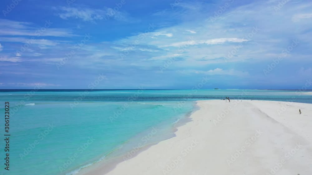 Paradise white beach with untouched sand washed gently by calm clear flows of turquoise lagoon under bright cloudy sky in Barbados Paradise white beach with untouched sand washed gently by calm clear flows of turquoise lagoon under bright cloudy sky in Barbados