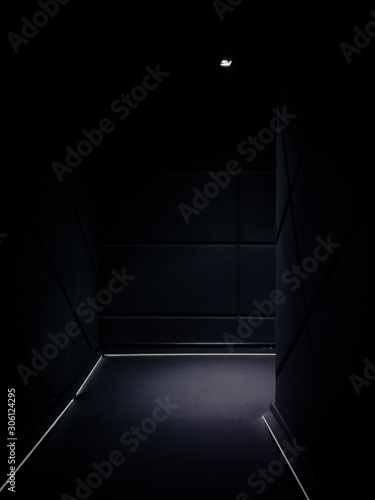 Corner of a dimmed empty corridor of a building