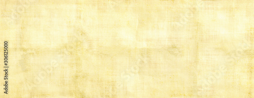Old yellow light paper background.Light colored vintage paper background for design,web page with copy spice.Long panoramic format.