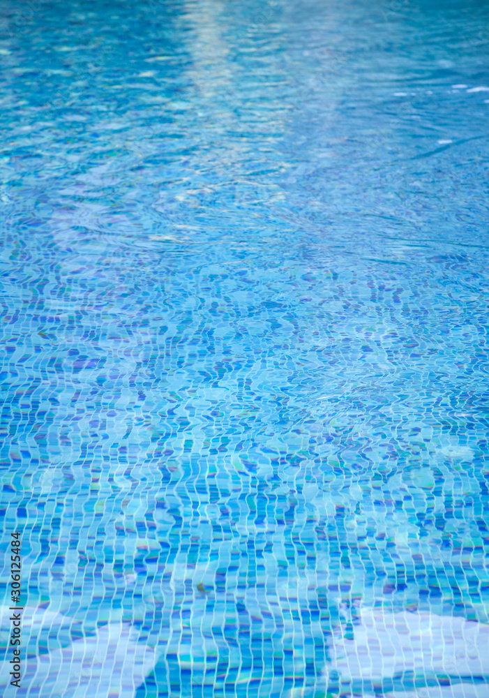 A close-up of sun reflections in pool water