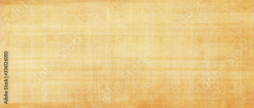 Papyrus yellow antique background.Egyptian paper,papyrus old texture. Smooth yellow surface.Mediterranean region.Long panoramic format.