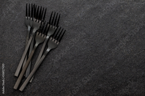 black forksd on gray ceramic background