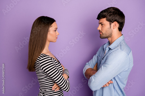 Obraz na plátně Profile photo of two people couple guy lady standing opposite angry looking eyes