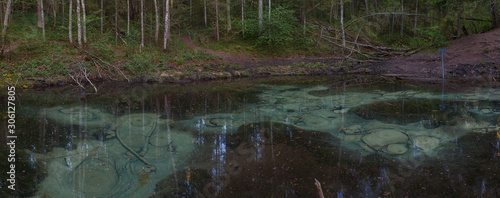 Sacrificial Saula blue springs in a pond  Estonia  Europe. Natural wonder