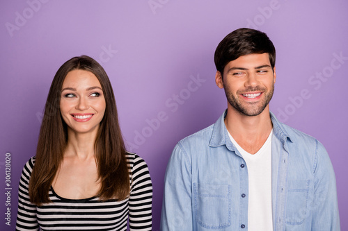 Photo of two people couple looking eyes each other have creative tricky plan know private secret wear stylish casual outfit isolated pastel purple color background