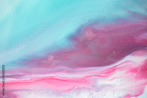 Abstract fluid acrylic painting. Marbled blue abstract background. Liquid marble pattern. Hand painted background with mixed liquid red, blue and green paints. Modern art. 