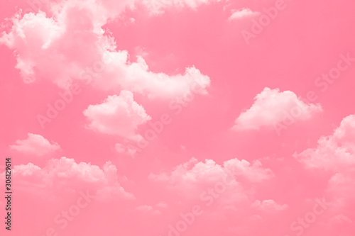 Pink sky background with white clouds.