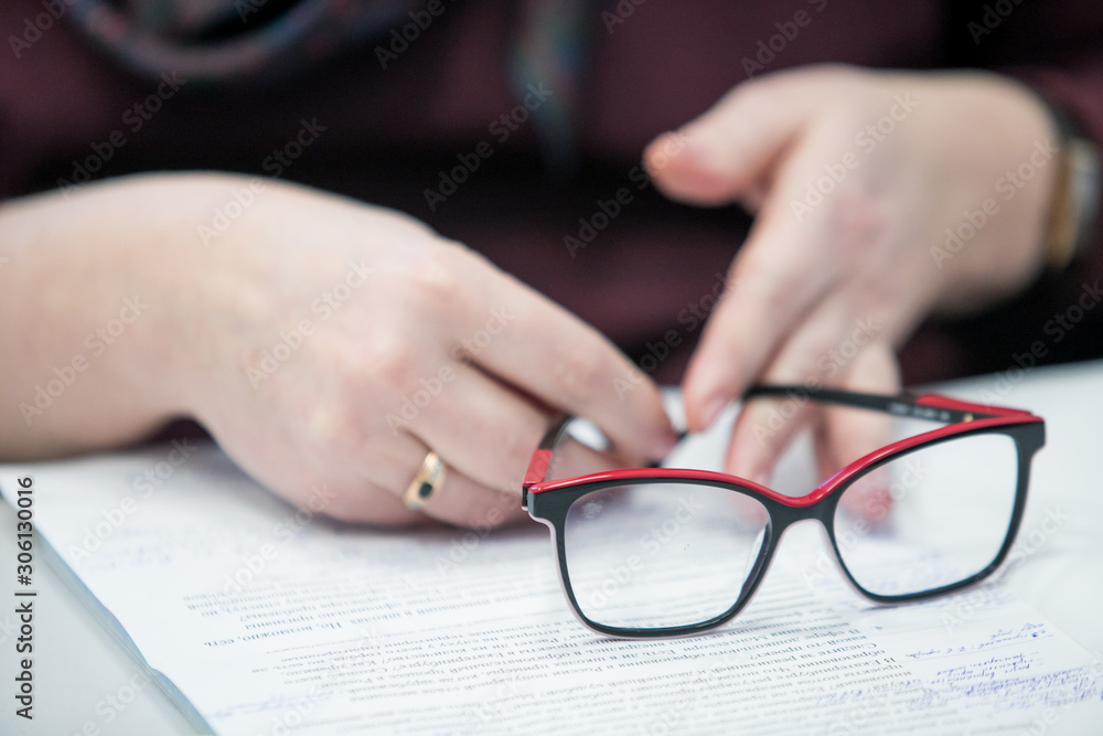 businessman using hand sign while talking to his colleague in office. businessman using hand sign while talking to his colleague in office.