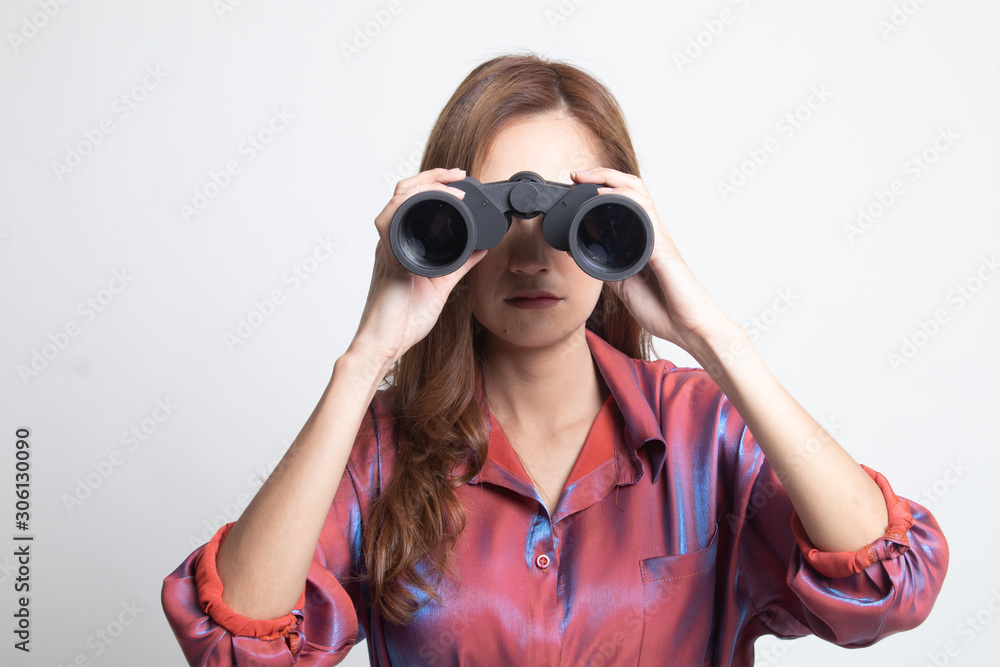 Young Asian woman with binoculars.