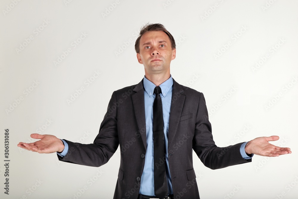 I don't know,portrait of a businessman wearing a black suit opened his hands and spread his arms out on white background,close up shot I don't know,portrait of a businessman wearing a black suit opened his hands and spread his arms out on white background,close up shot