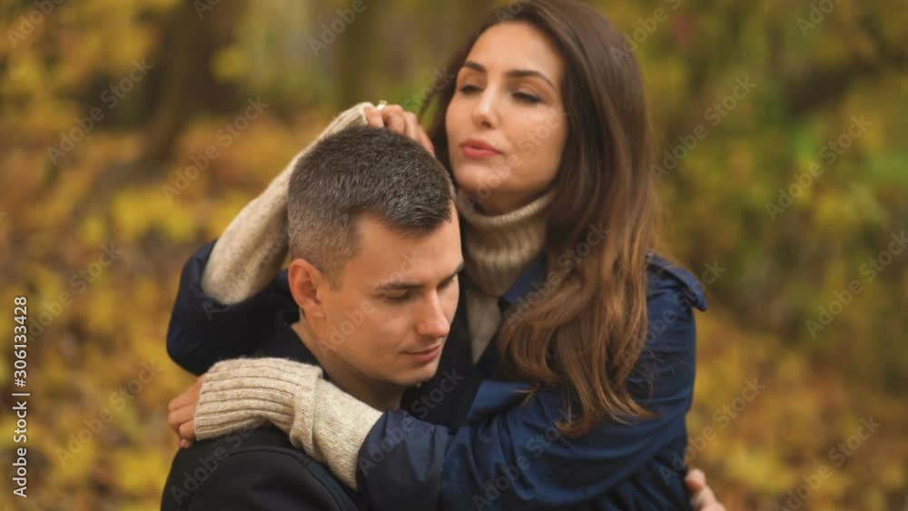 pair of lovers communicates and enjoys each other's company in the autumn park pair of lovers communicates and enjoys each other's company in the autumn park