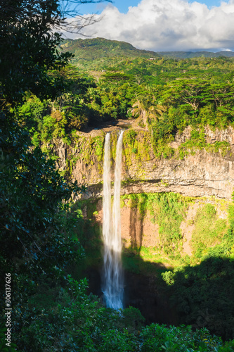 Chamarel waterfall with rocks in tropical jungle of Mauritius