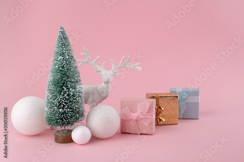 Creative layout made of Christmas decorations on pink background. Holiday background.