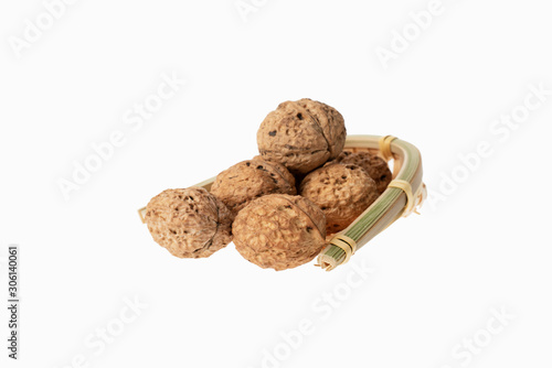 walnut in chinese container on white background