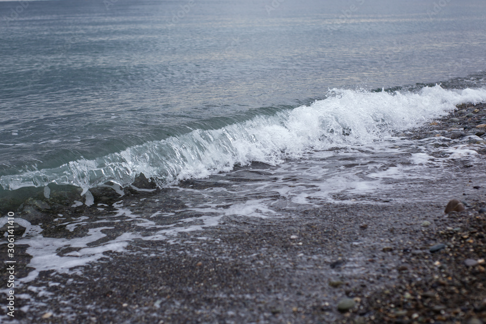 waves breaking on beach waves breaking on beach