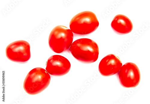 Red cherry tomatoes on a white background