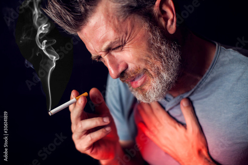 Man smokes cigarette and has problem with lungs. Cigarette addiction concept